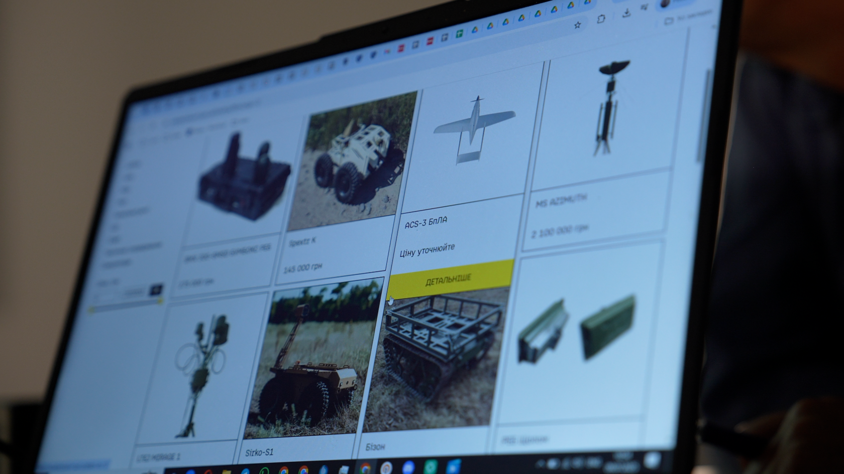 A computer screen shows the weapons marketplac