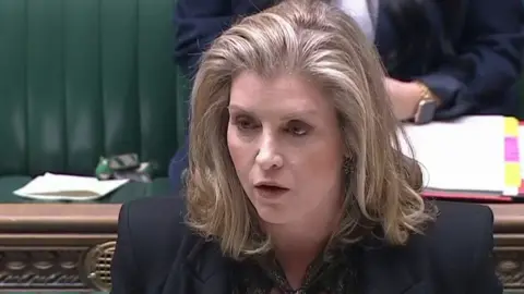 PA Media Penny Mordaunt